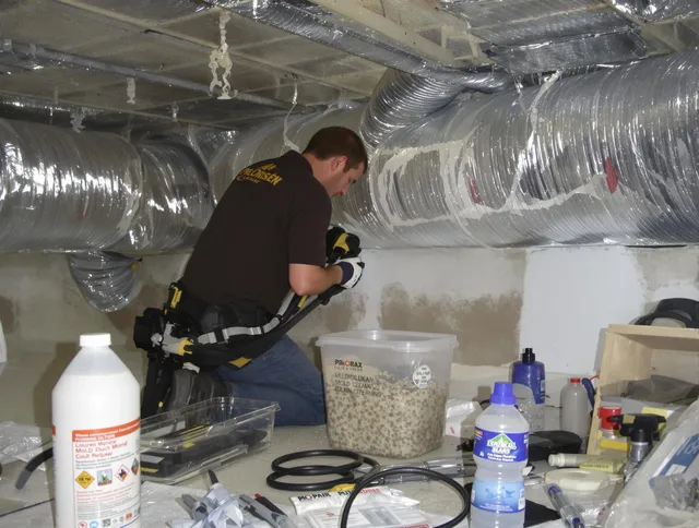 Ipswich Air Duct Cleaning specialist performing professional mold removal from air ducts in Ipswich