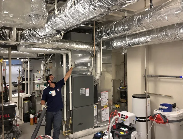 Ipswich Air Duct Cleaning specialist performing thorough furnace duct cleaning in a Ipswich residence
