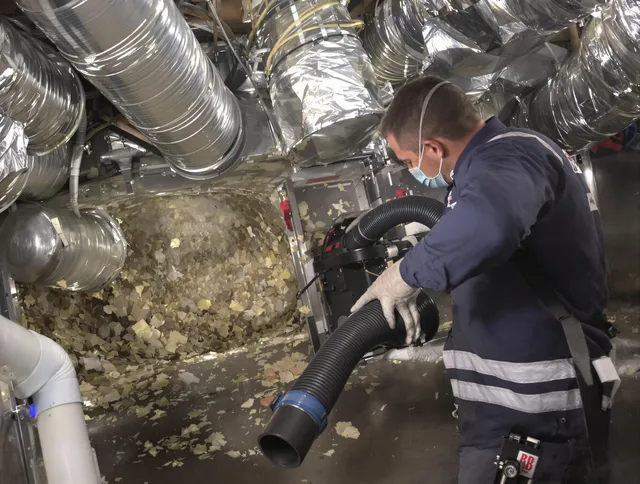 Ipswich Air Duct Cleaning specialist operating negative pressure cleaning equipment for thorough duct maintenance in Ipswich