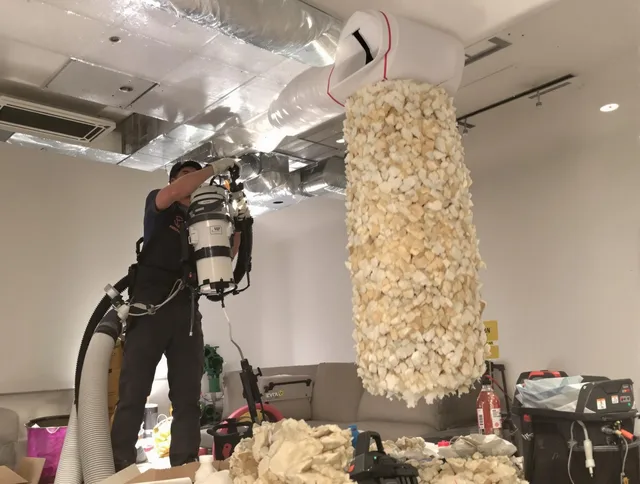 Ipswich Air Duct Cleaning technician performing precision vacuum insulation removal in a residential property in Ipswich